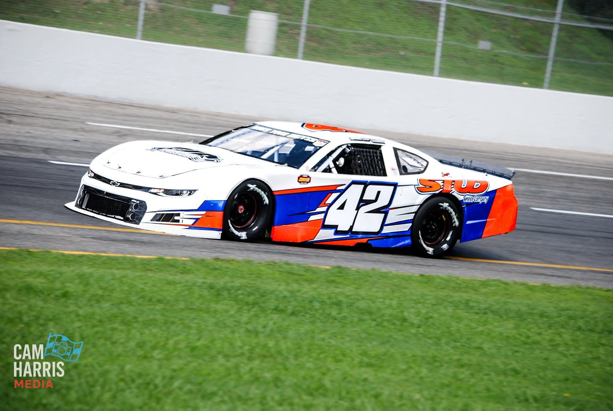 The #42 STUD car on track during a daytime race