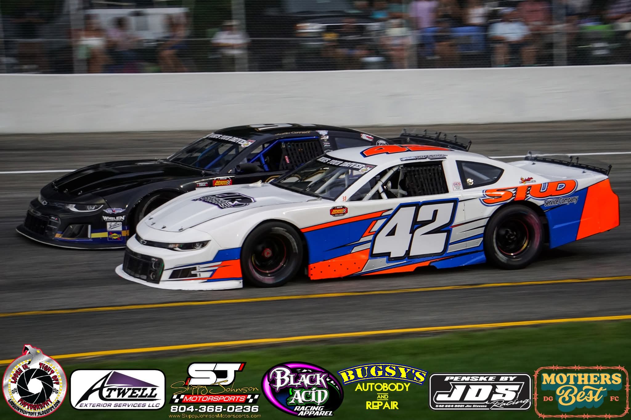 The #42 on track with fans in the grandstands